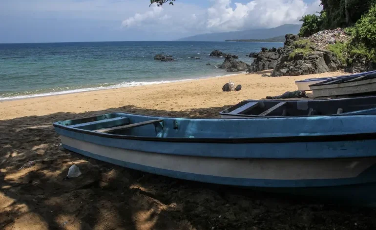 Boats sit on Plage de Moya south of the city of Mutsamudu, the capital of Anjouan in the Comoros Archipelago, one of the main points of departure for refugees
