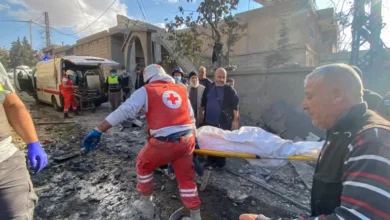 Rescuers carry a body at the site of an Israeli attack in the eastern village of Bazzaliyeh in Bekaa Valley's Hermel district, Lebanon, November 1, 2024