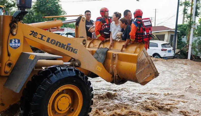 Floods in Beijing have submerged roads and left residents stranded