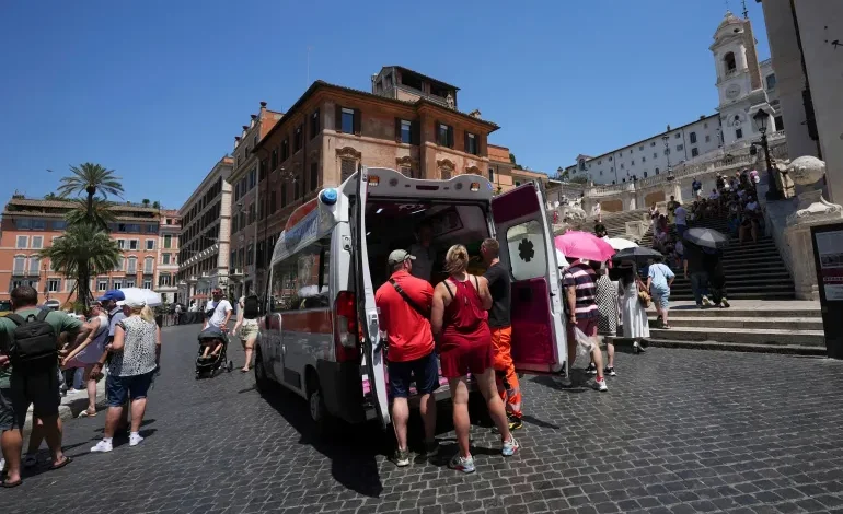Paramedics provide aid to tourists and residents with an ambulance