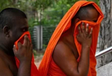 AFP via Getty Images Two of the arrested monks arriving at court on Sunday
