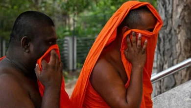 AFP via Getty Images Two of the arrested monks arriving at court on Sunday