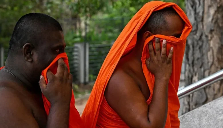 AFP via Getty Images Two of the arrested monks arriving at court on Sunday