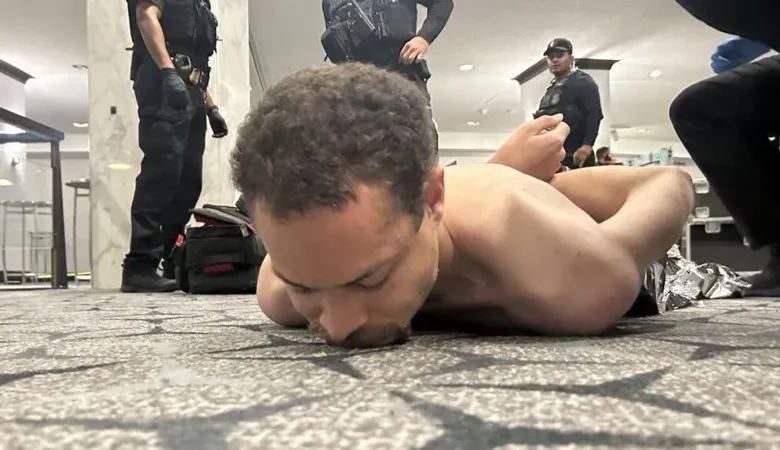 President Trump shared this photo appearing to show the shirtless suspect on the floor of the Washington Hilton hotel