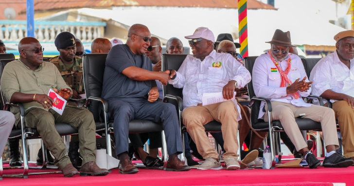 Joshua Ansah (3rd from right), Secretary-General, TUC, in a hearty handshake with President John Dramani Mahama at the May Day commemoration. Looking on are Julius Drebrah (left), Chief of Staff, and other dignitaries.