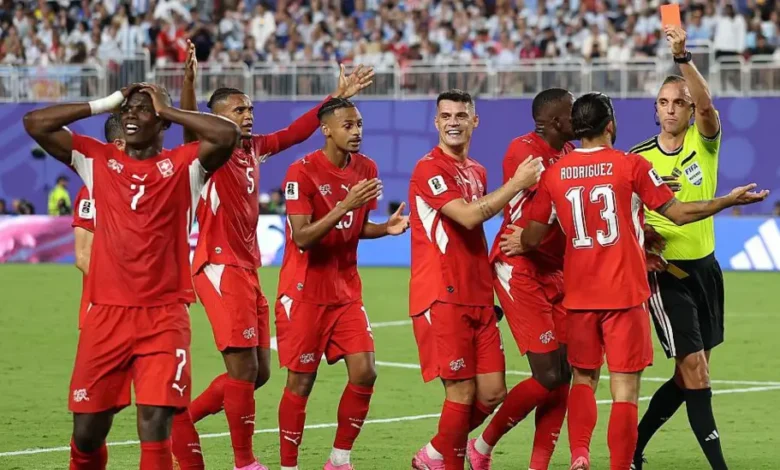 Switzerland were left with 10 men against Argentina after Breel Embolo, left, received a second yellow card for simulation