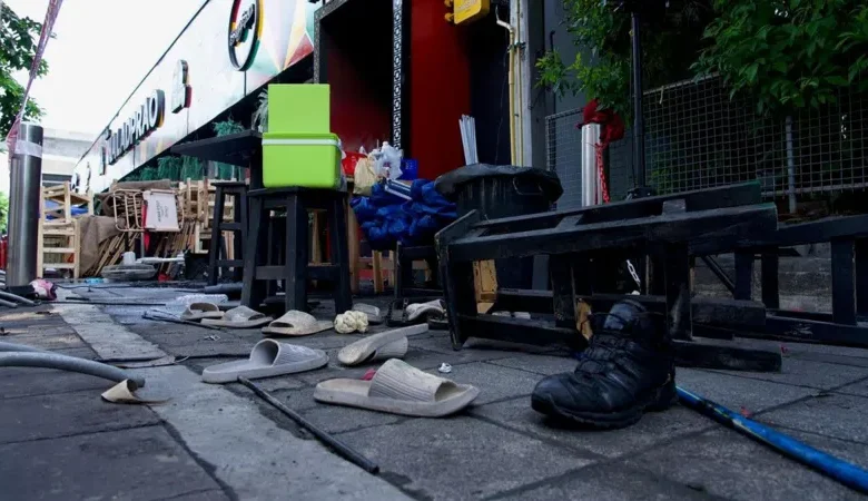 People were seen scrambling outside as a massive blaze ripped through the bar