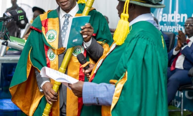 Prof Eric Kwasi Ofori holding his staff of office