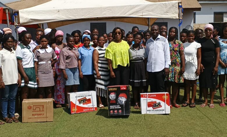 Honorable Laurrette Korkor Asante in green blouse in a group photo with the beneficiries